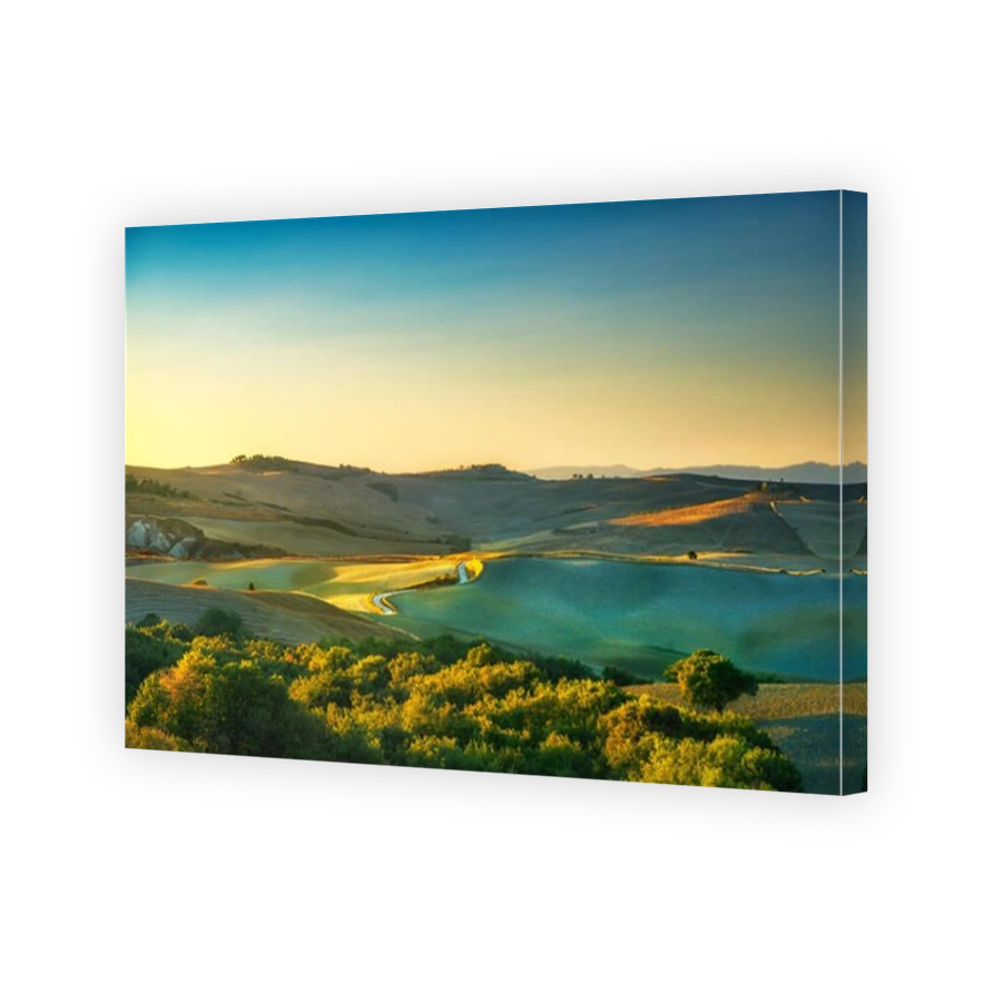 Tuscany countryside, road, fields and rolling hills at sunset. Italy, Europe