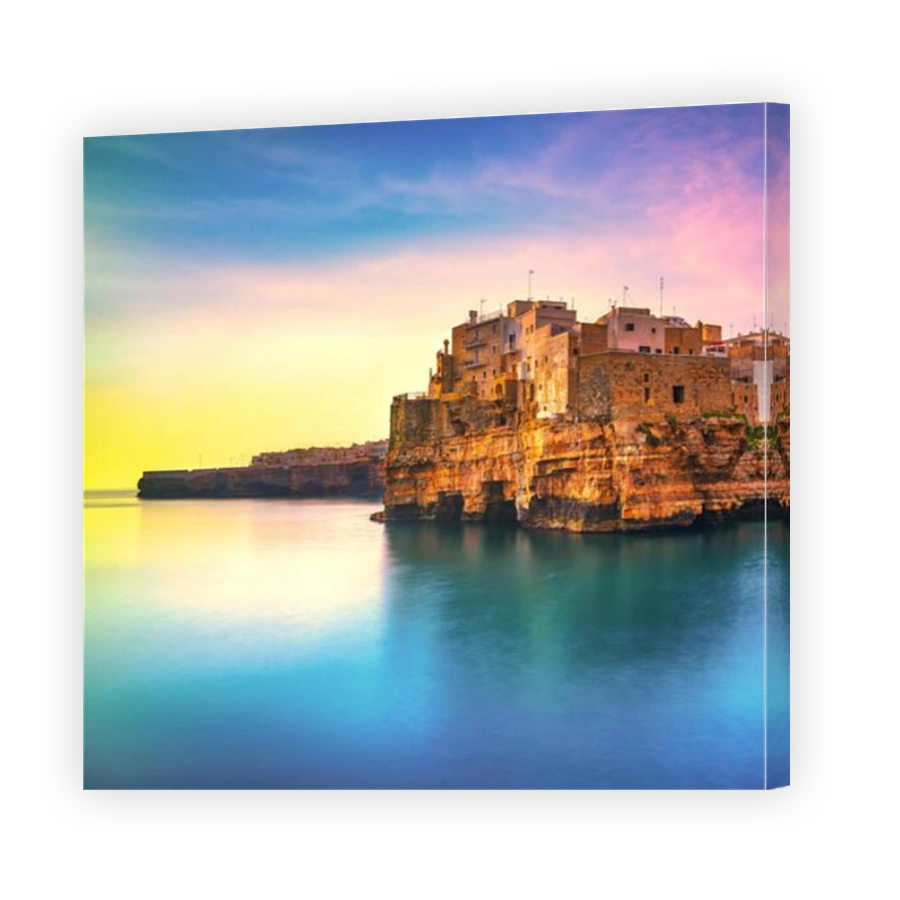 Polignano a Mare village on the rocks at sunrise, Bari, Apulia, southern Italy. Europe. Long Exposure.