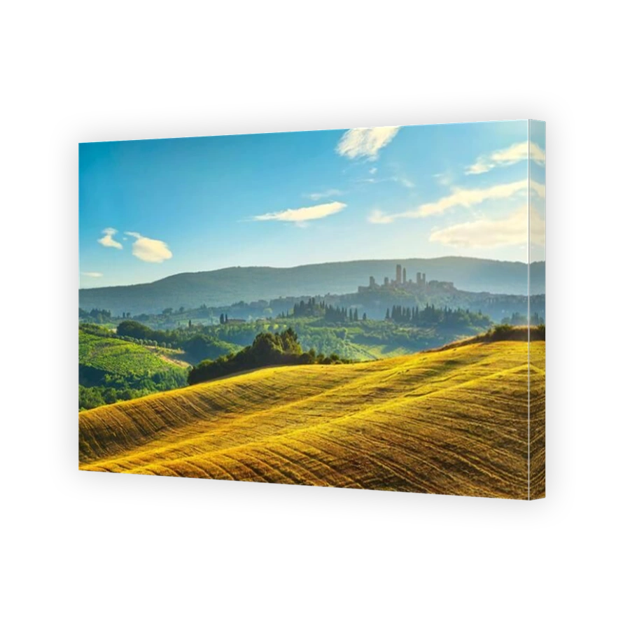 San Gimignano medieval town towers skyline and countryside landscape panorama at sunset. Tuscany, Italy, Europe.