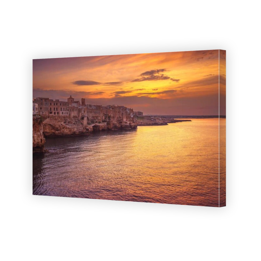 Polignano a Mare village on the rocks at sunset, Bari, Apulia, southern Italy. Europe.