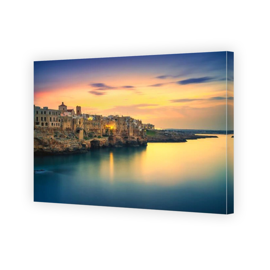 Polignano a Mare village on the rocks at sunset, Bari, Apulia, southern Italy. Europe.