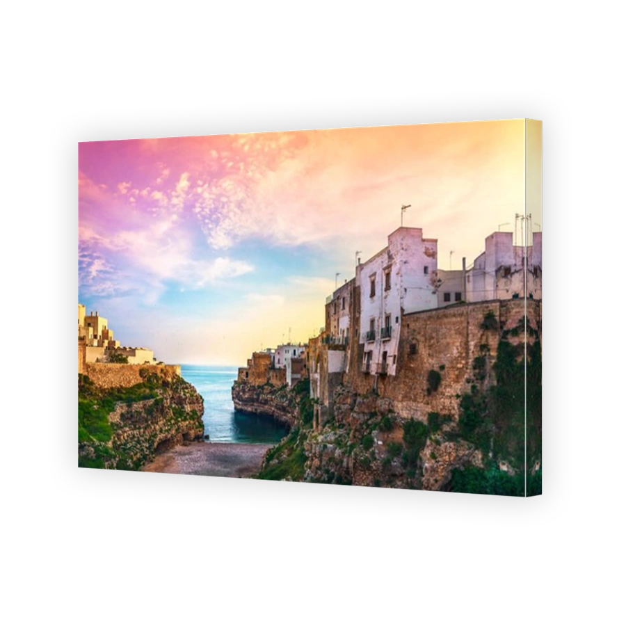 Polignano a Mare village on the rocks at sunrise, Bari, Apulia, southern Italy. Europe.