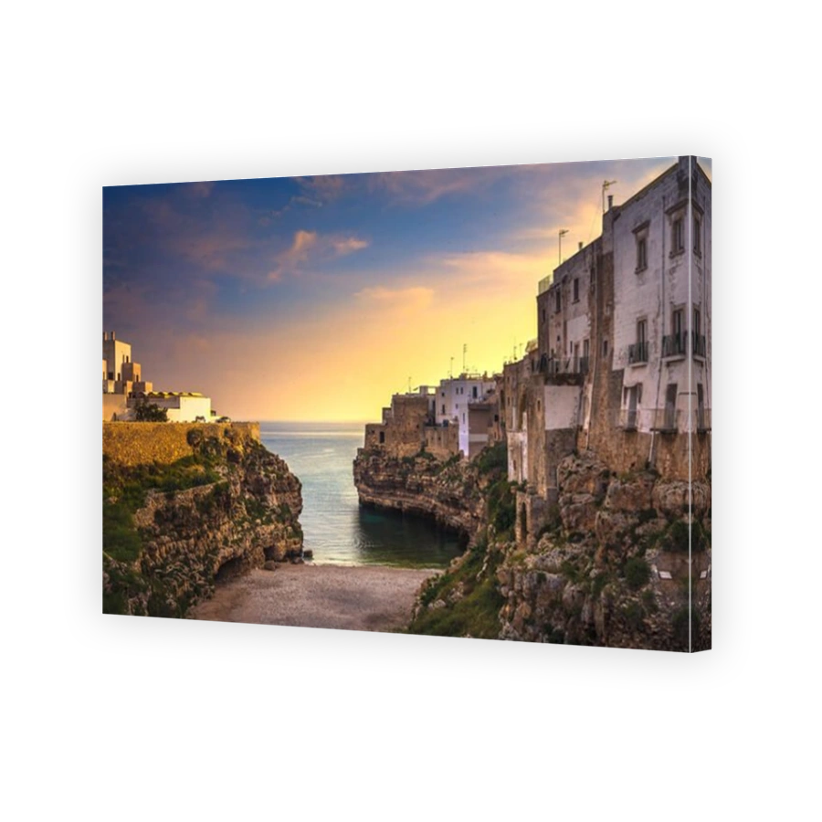 Polignano a Mare village on the rocks at sunrise, Bari, Apulia, southern Italy. Europe.