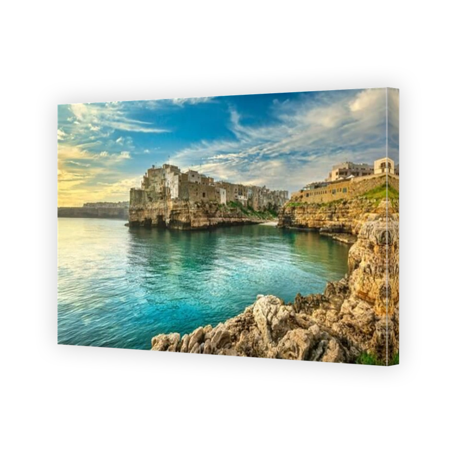 Polignano a Mare village on the rocks at sunrise, Bari, Apulia, southern Italy. Europe.