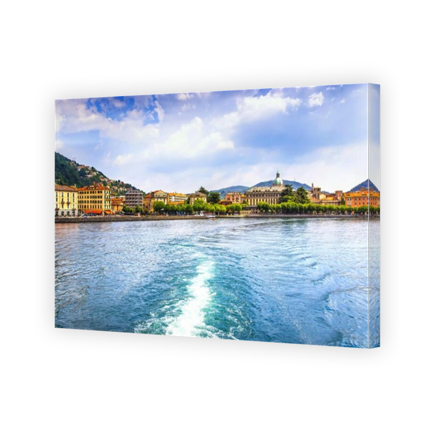 Como city in italian lake district from ferry boat. Italy, Europe.