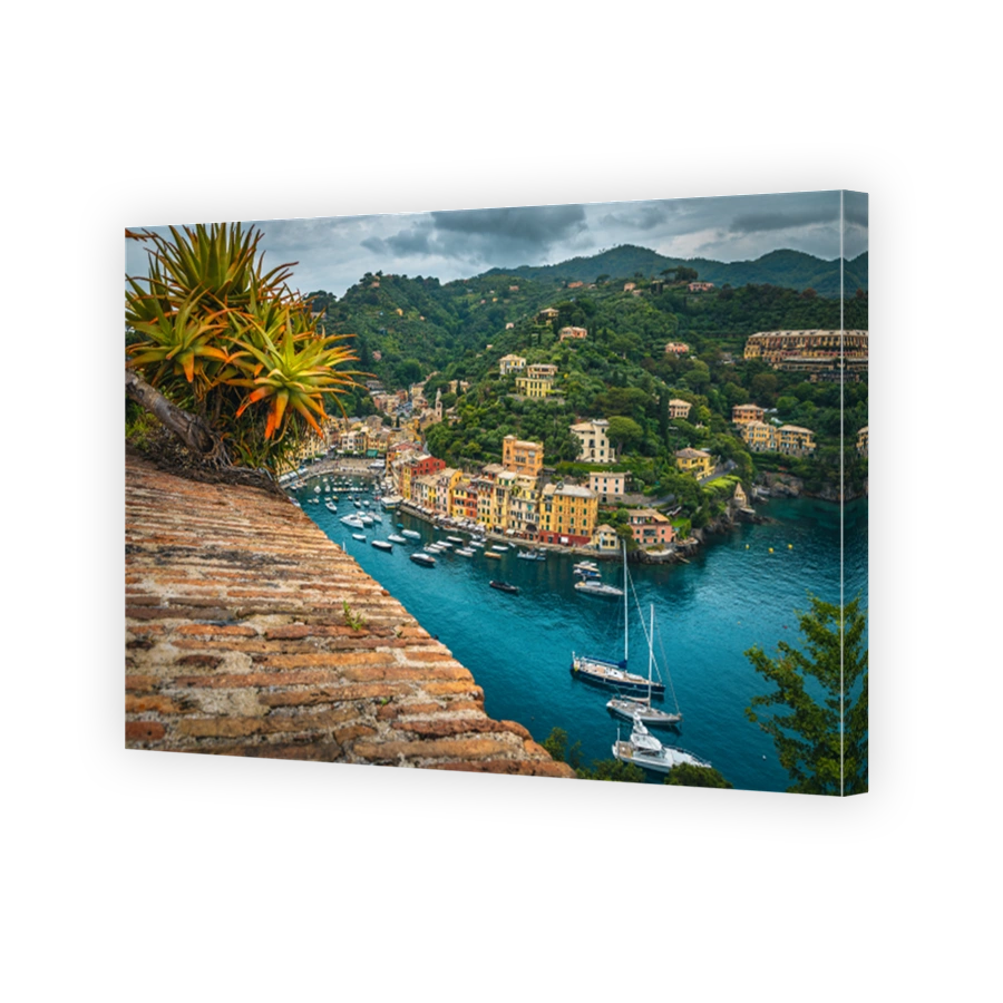 Anchored boats and yachts in the marina of Portofino, Italy