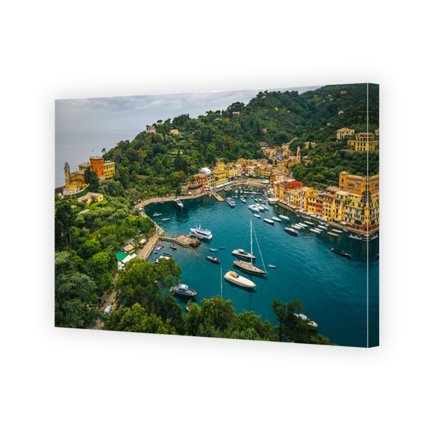 Colorful seaside buildings and moored boats in Portofino, Liguria, italy