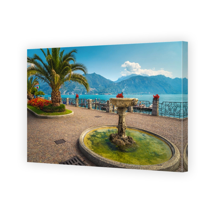 Water fountain and flowery park on the walkway, Menaggio, Italy