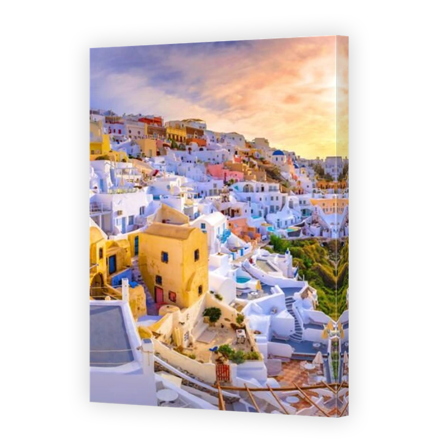 Oia town on Santorini island, Greece. Traditional and famous houses and churches with blue domes over the Caldera, Aegean sea