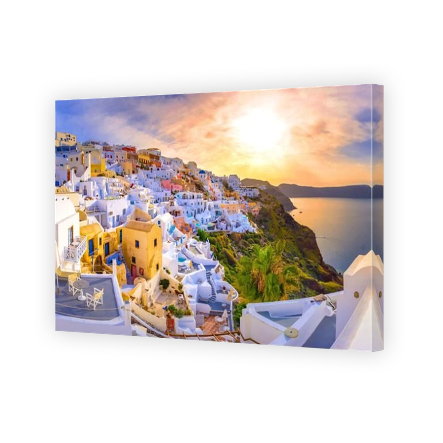 Oia town on Santorini island, Greece. Traditional and famous houses and churches with blue domes over the Caldera, Aegean sea