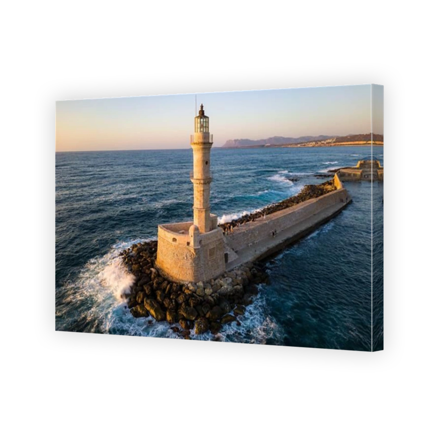 Ancient Venetian lighthouse in the Greek town of Chania (Crete) in beautiful golden sunlight at dusk