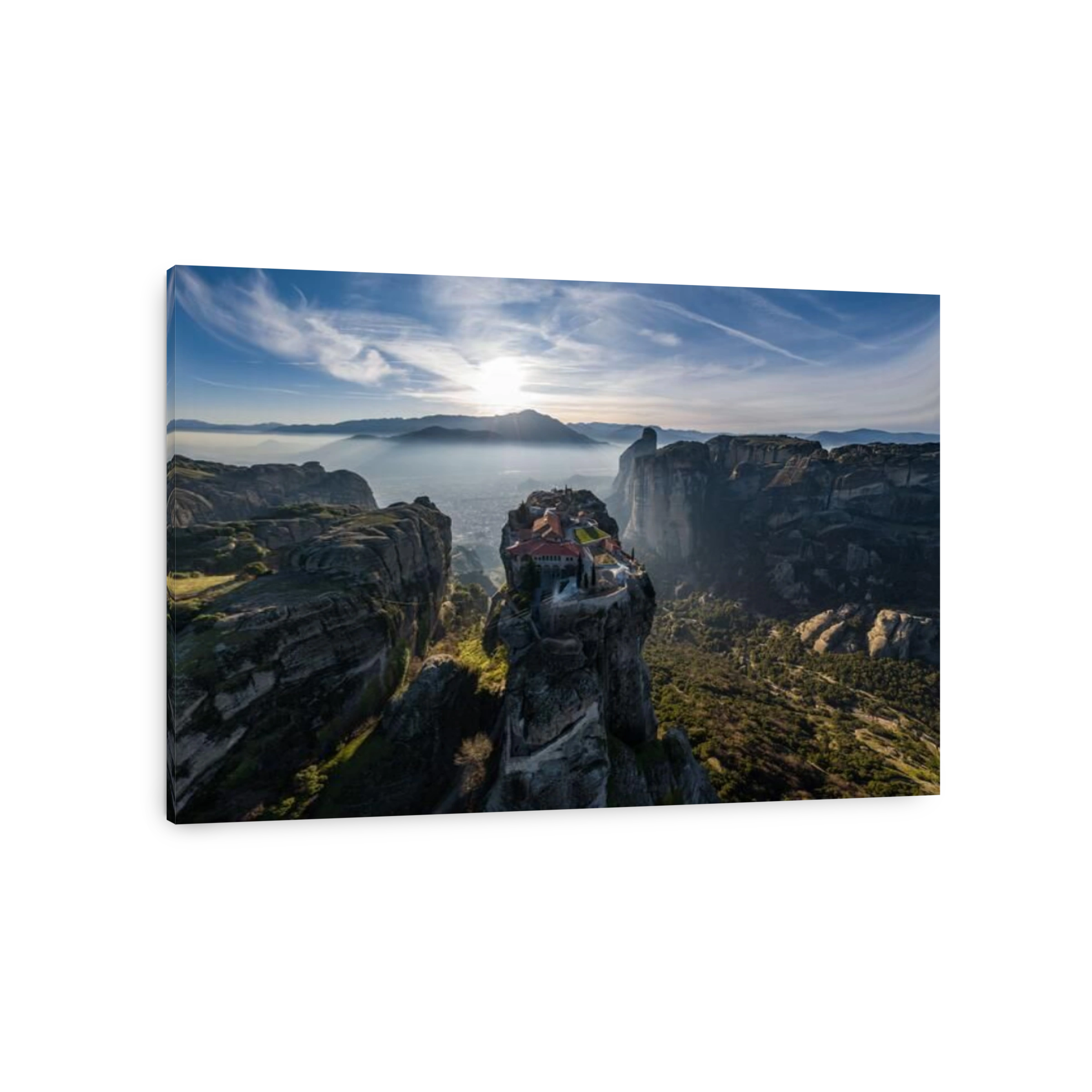 Aerial view of monastery Trinity and breathtaking pictures of valley and landmark canyon of Meteora at sunset, Kalambaka, Greece, shadows, twisted roa