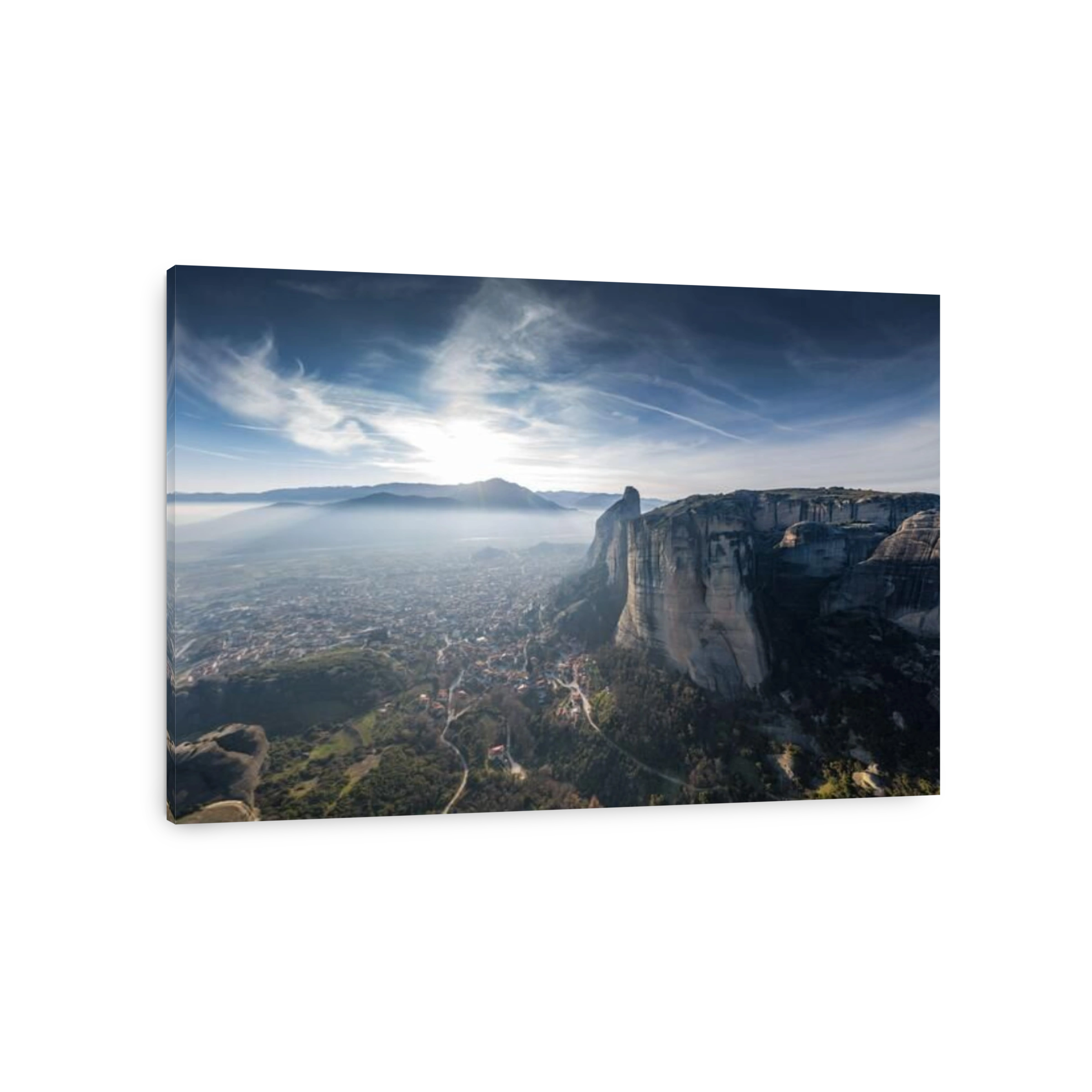 Aerial view of Unesco monument Meteora, the mountains, the landmark of Greek, sunny weather, fog, haze over a valley