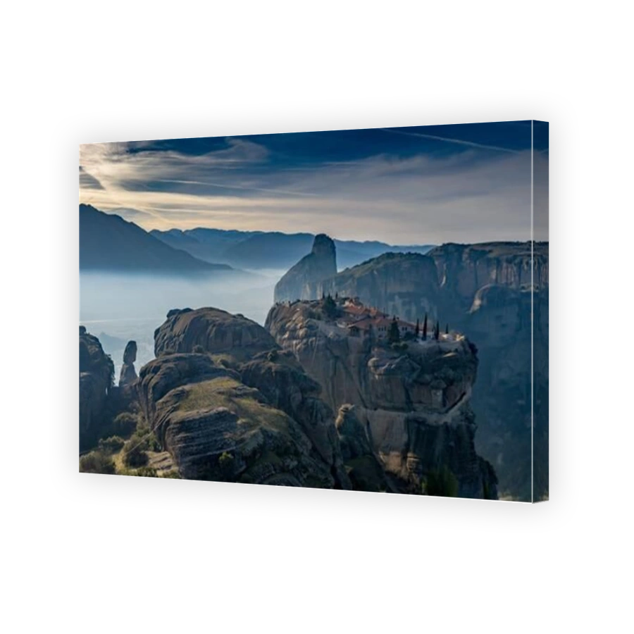 Aerial view of monastery Trinity and breathtaking pictures of valley and landmark canyon of Meteora at sunset, Kalambaka, Greece, shadows, twisted roa