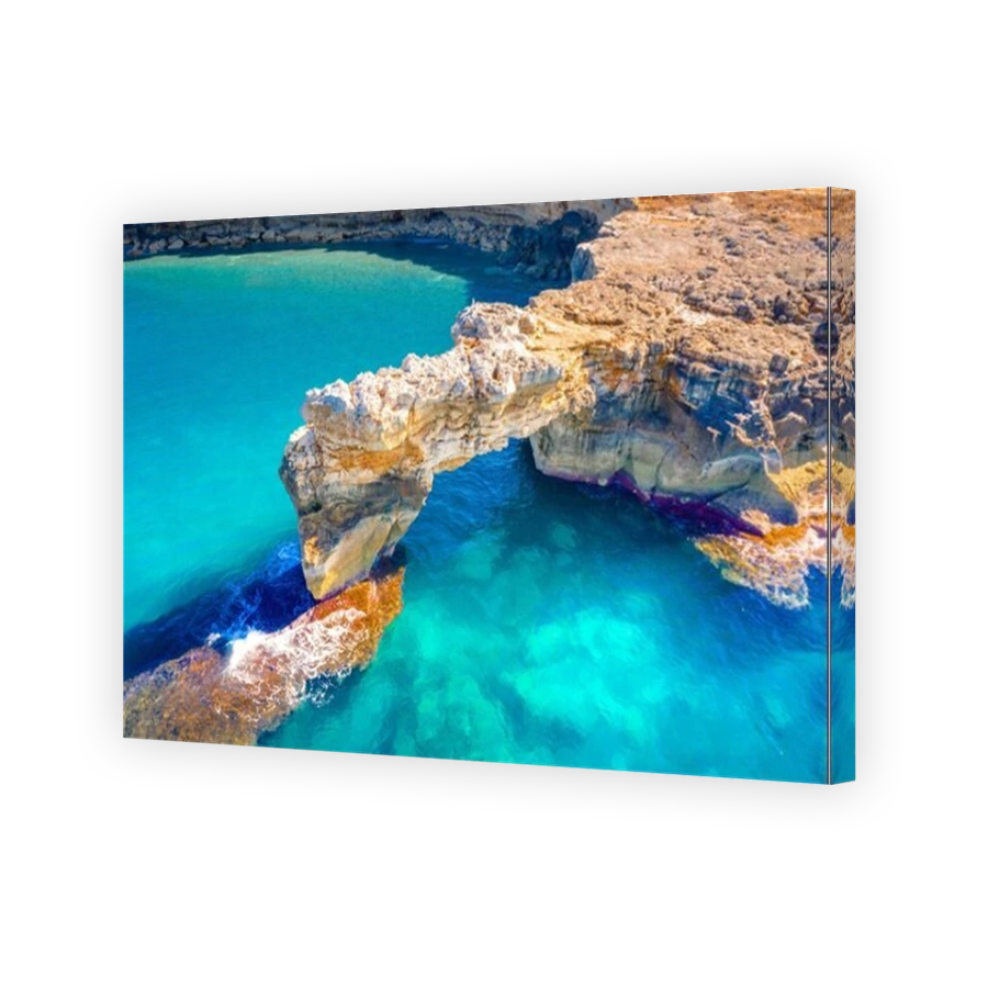Aerial view of beautiful natural big rock arch Kamara Geropotamou, near sandy beach and river,  Rethimno, Crete, Greece.