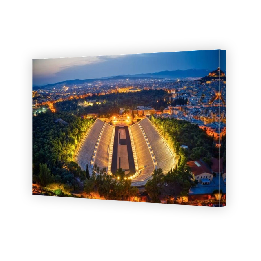 Aerial night shot of iconic illuminated ancient Kalimarmaro or Panathenaic stadium, venue of first Olympics games in Athens, Attica, Greece