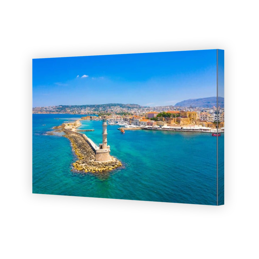 Panorama of the beautiful old harbor of Chania with the amazing lighthouse, mosque, venetian shipyards, Crete, Greece.