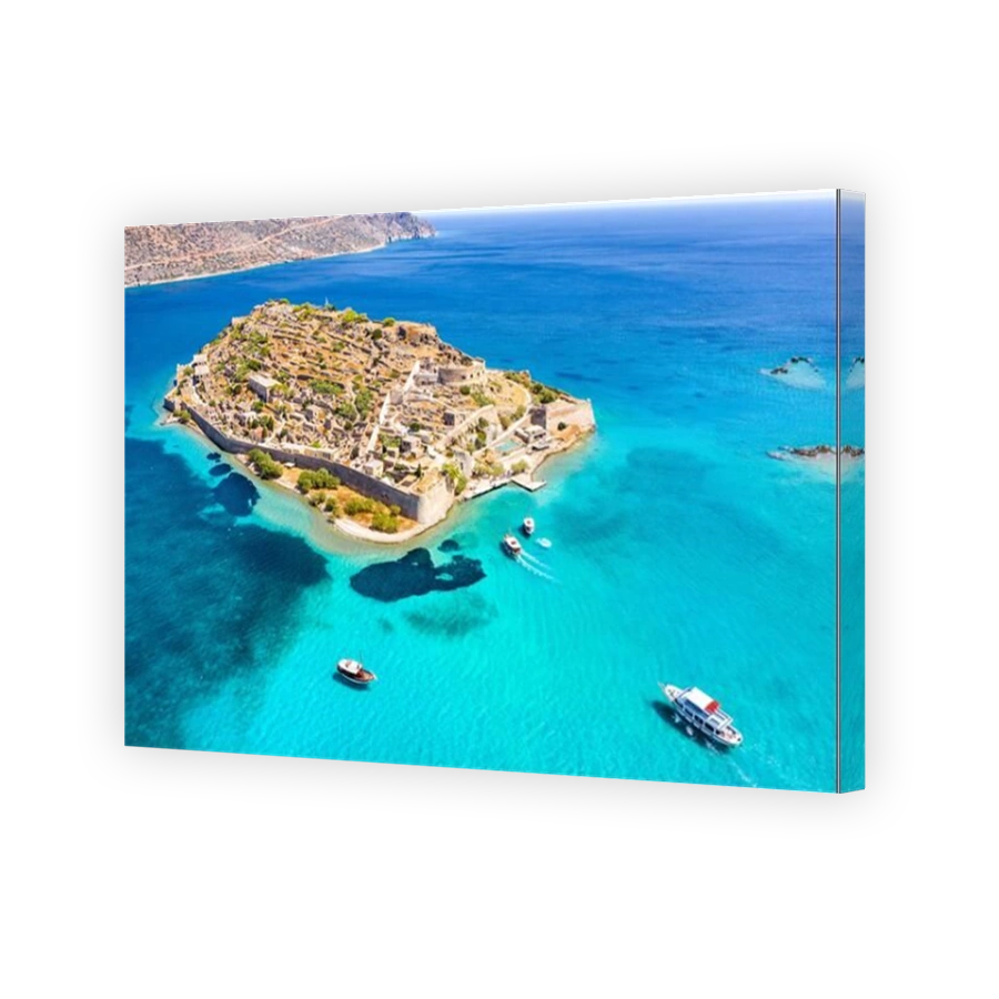 View of the island of Spinalonga with calm sea. Here were isolated lepers, humans with the Hansen's desease, gulf of Elounda, Crete, Greece.