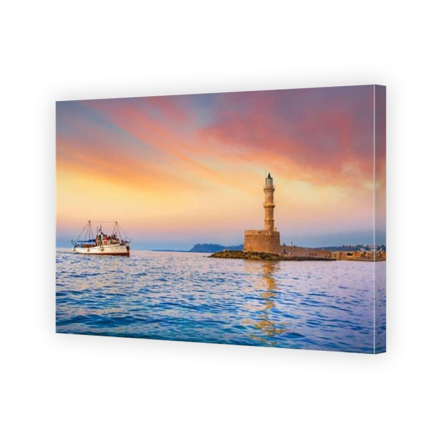 Panorama of the beautiful old harbor of Chania with the amazing lighthouse, mosque, venetian shipyards, at sunset, Crete, Greece.