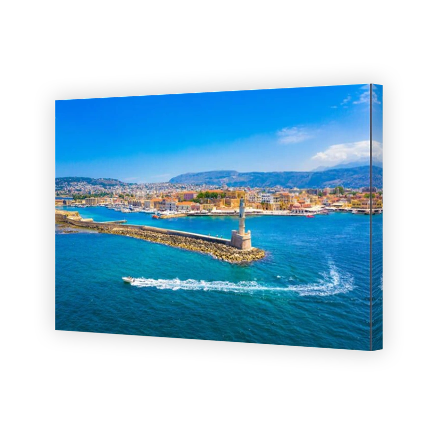 Panorama of the beautiful old harbor of Chania with the amazing lighthouse, mosque, venetian shipyards, Crete, Greece.
