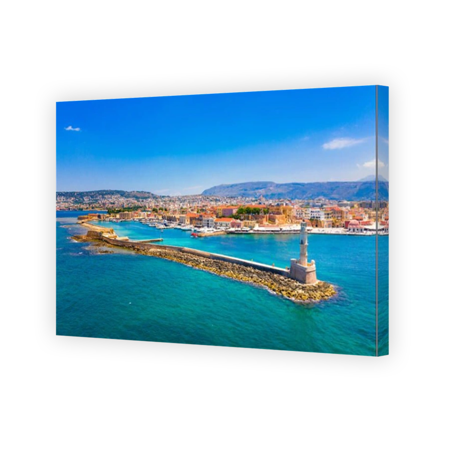Panorama of the beautiful old harbor of Chania with the amazing lighthouse, mosque, venetian shipyards, Crete, Greece.