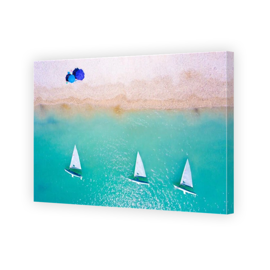 Tourist at the beach with yacht boats and clear blue waters in Lefkada Greece