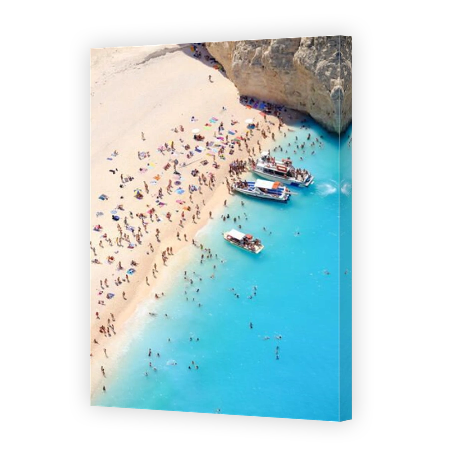 Tourists on the sand beach of Navagio Zakynthos Greece.