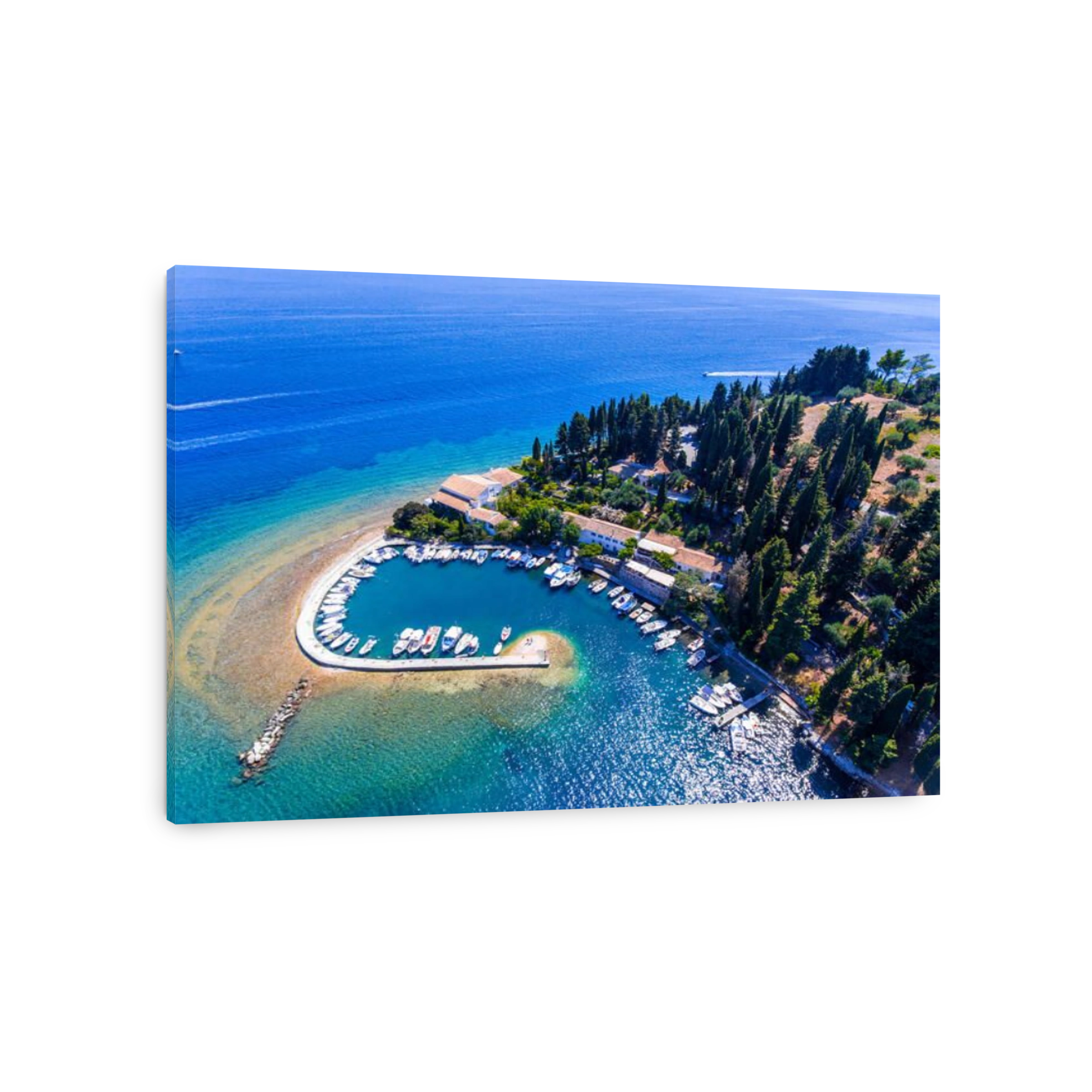 The old harbor and fishing village Kouloura. Corfu (Kerkyra) Island, Greece, Europe. Fishing boats and clear blue waters.