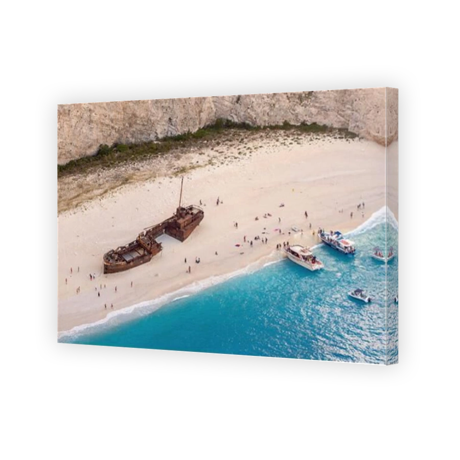An aerial view of old boat ruins on a Navagio beach in Zakynthos.