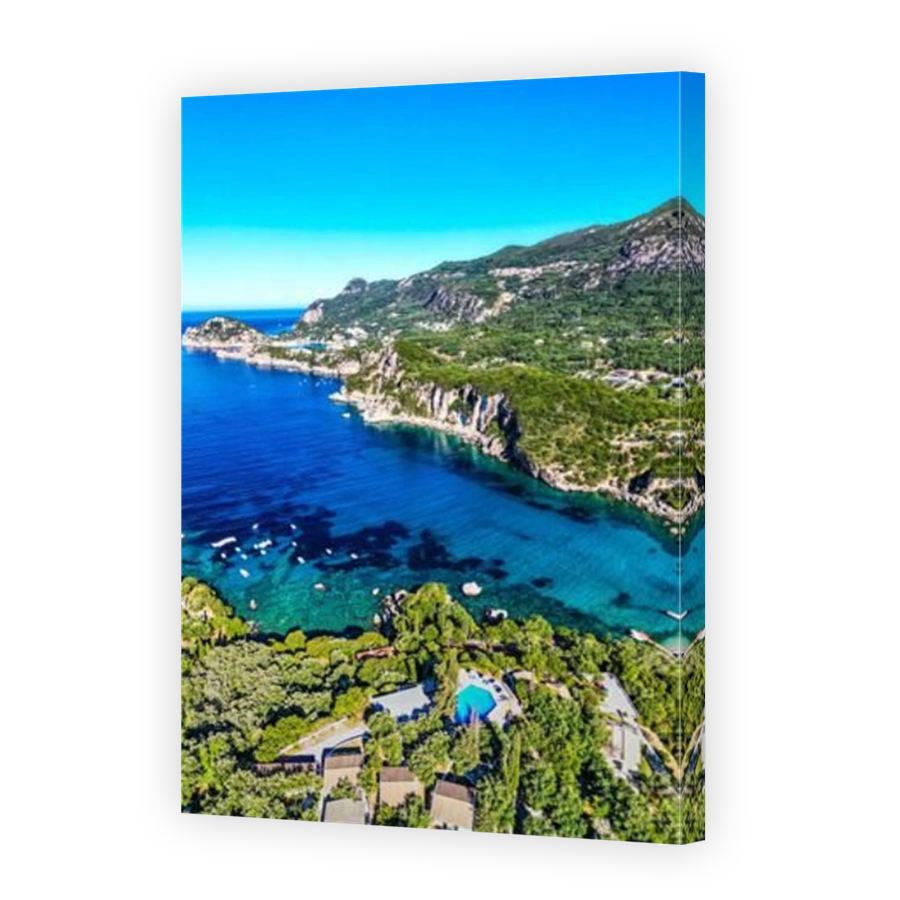 A vertical aerial of Corfu island surrounded by turquoise waters of Ionian sea, Cape Drastis in Greece