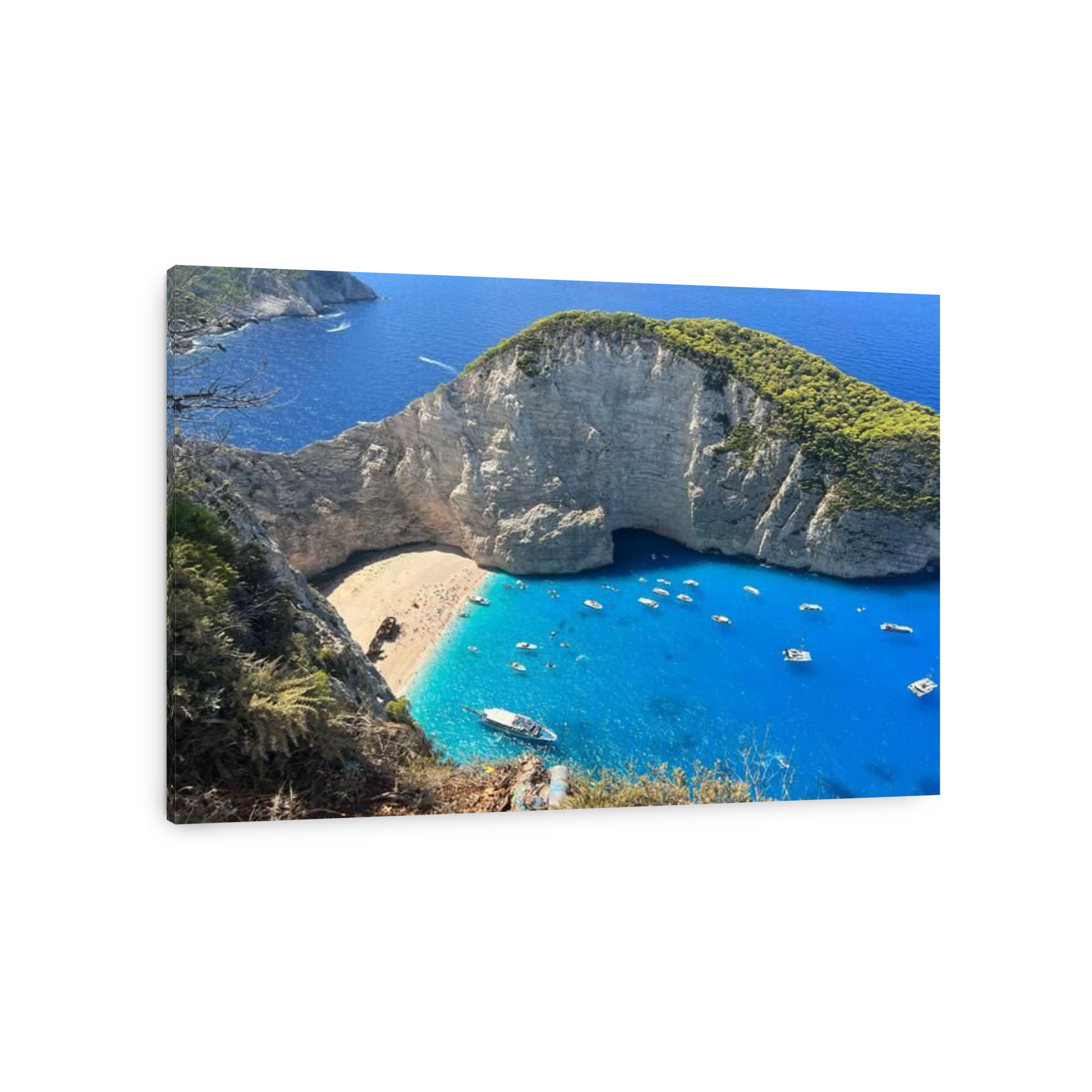 An aerial drone shot of Zakynthos island, Greece, with boats in the sea