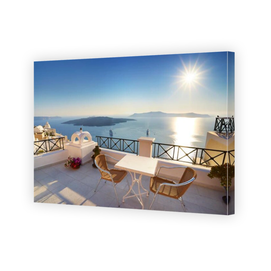 Thira (capital city of Santorini) - terrace with a background view to the sea and sun on the sky, Santorini Island,  Greece