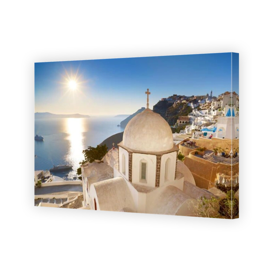 Thira (capital city of Santorini) - greek white church overlooking the sea and sun on blue sky, Santorini Island, Greece