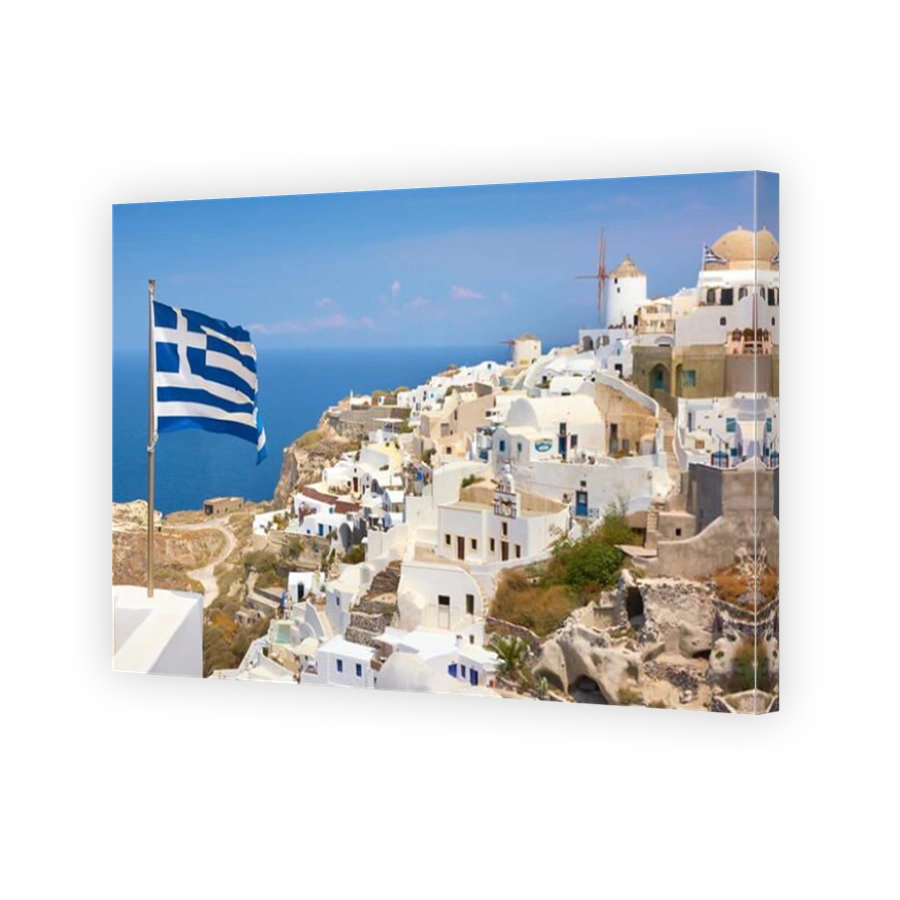 Greek flag in Oia Town (northern part of the Santorini) - view from the castle, Santorini Island, Cyclades, Greece