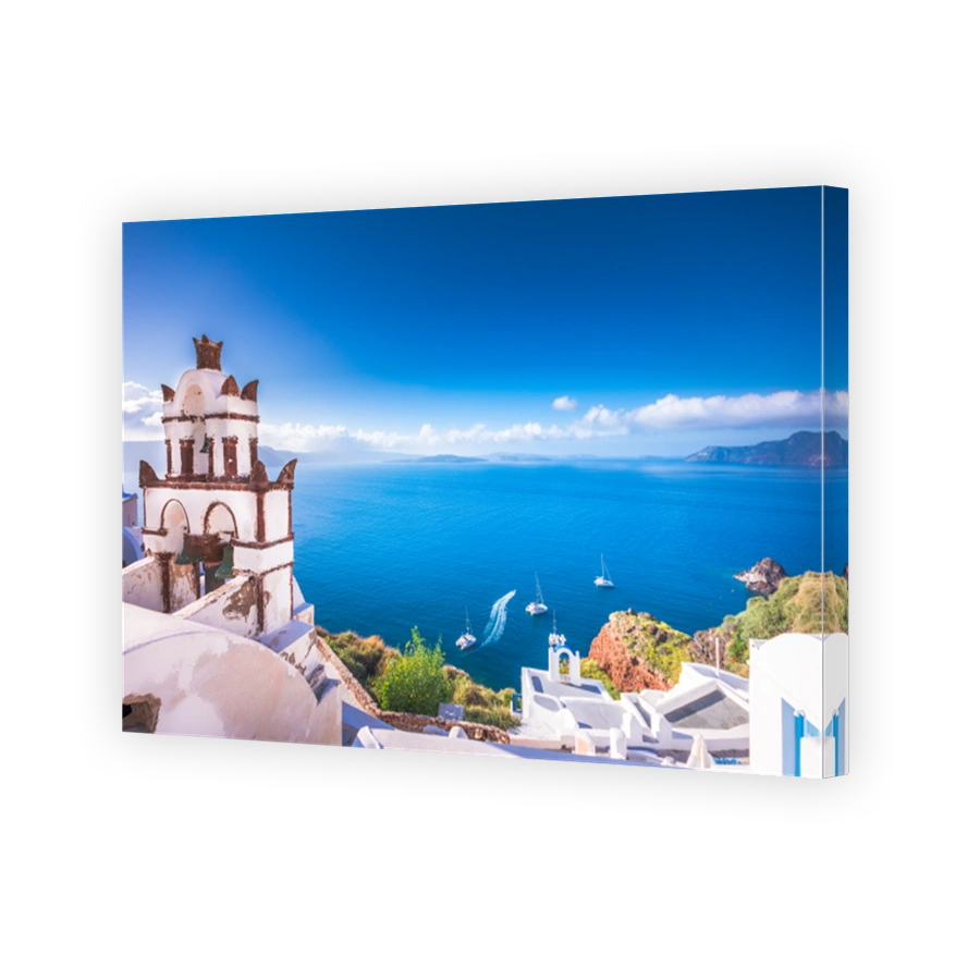 Oia town on Santorini island, Greece. Traditional and famous houses and churches with blue domes over the Caldera, Aegean sea