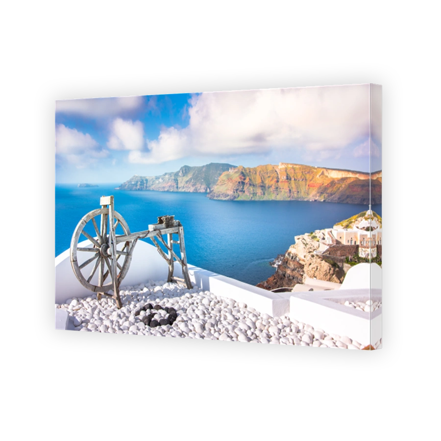 Oia town on Santorini island, Greece. Traditional and famous houses and churches with blue domes over the Caldera, Aegean sea