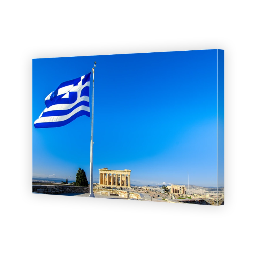 Parthenon temple on the Acropolis in Athens, Greece with Greek flag.