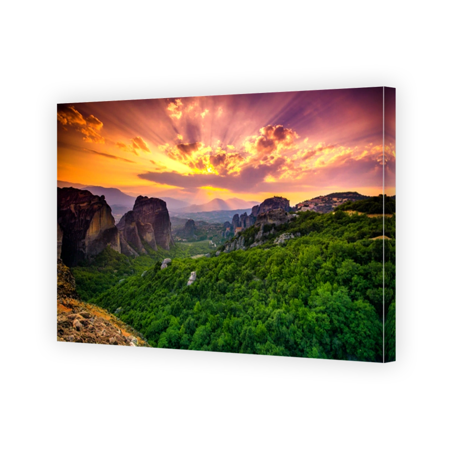 Breathtaking view of Meteora at sunset, Greece. Geological formations of big rocks with Monasteries  on top of them.