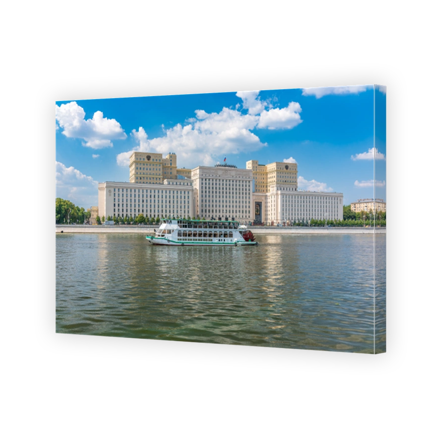 View of the Ministry of Defence of Russian Federation, and Moscow river embakment with cruise ships at sunset.
