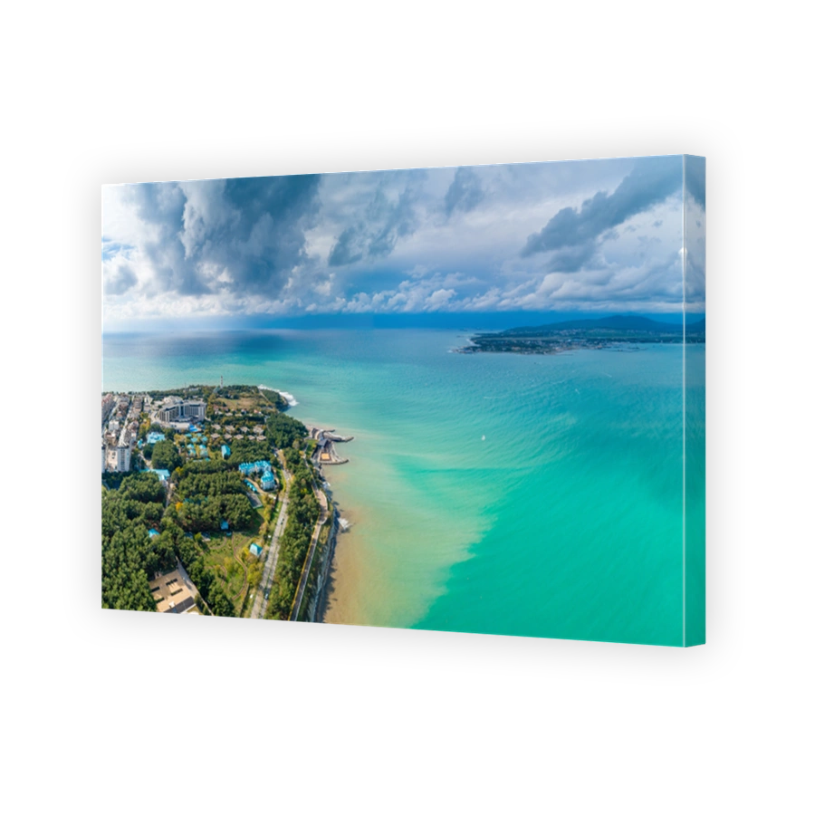 Gelendzhik resort. "Thick" cape and entrance to Gelendzhik Bay. Beautiful green water of Black Sea. On the "Tolstoy" cape, Gelendzhik lighthouse and hotels. Aerial view