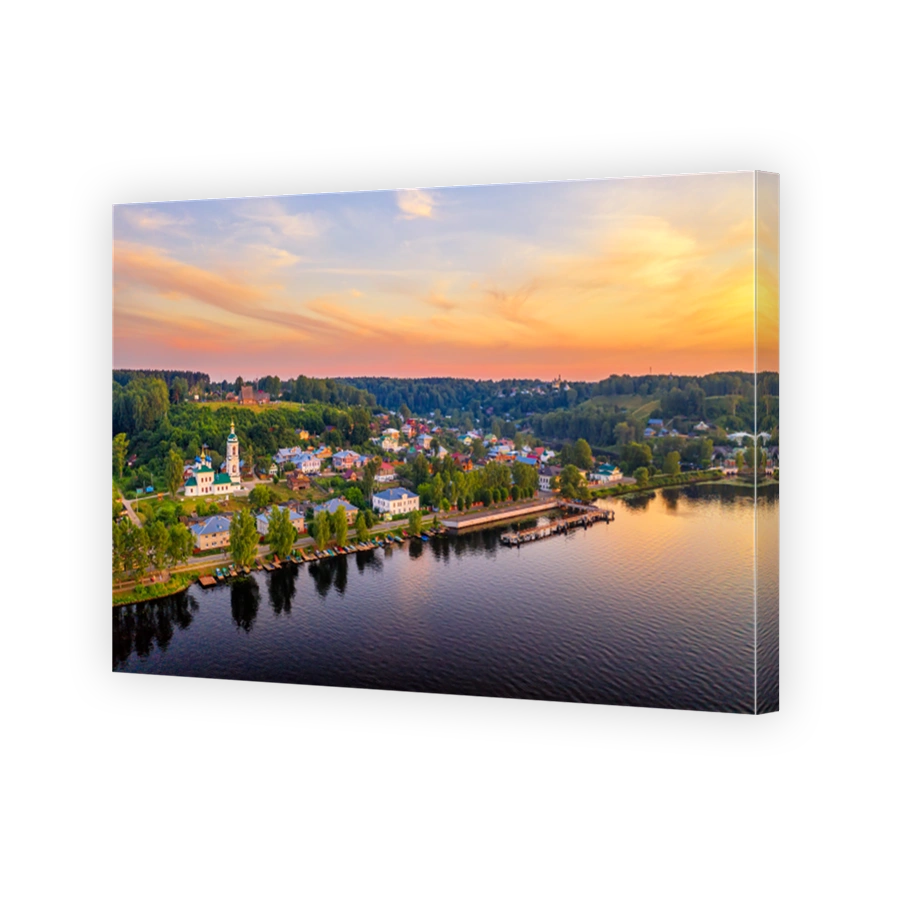 Aerial drone view of ancient russian town Ples on the Volga river with colorful sunset