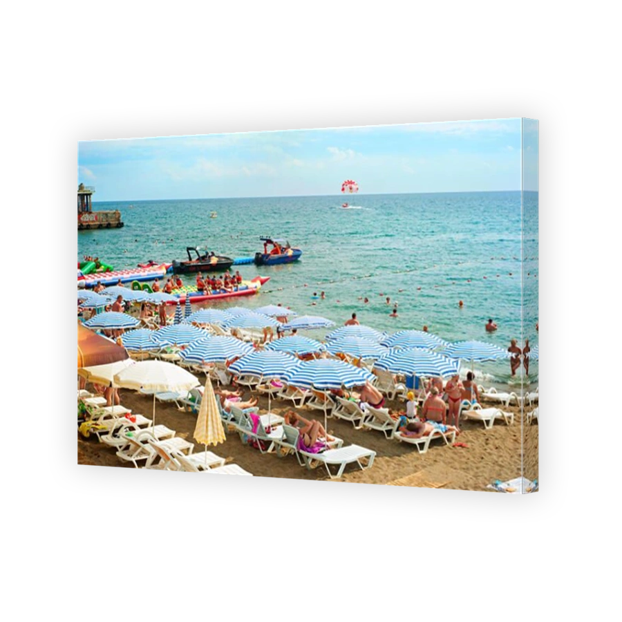 People at a sea beach in Sudak.