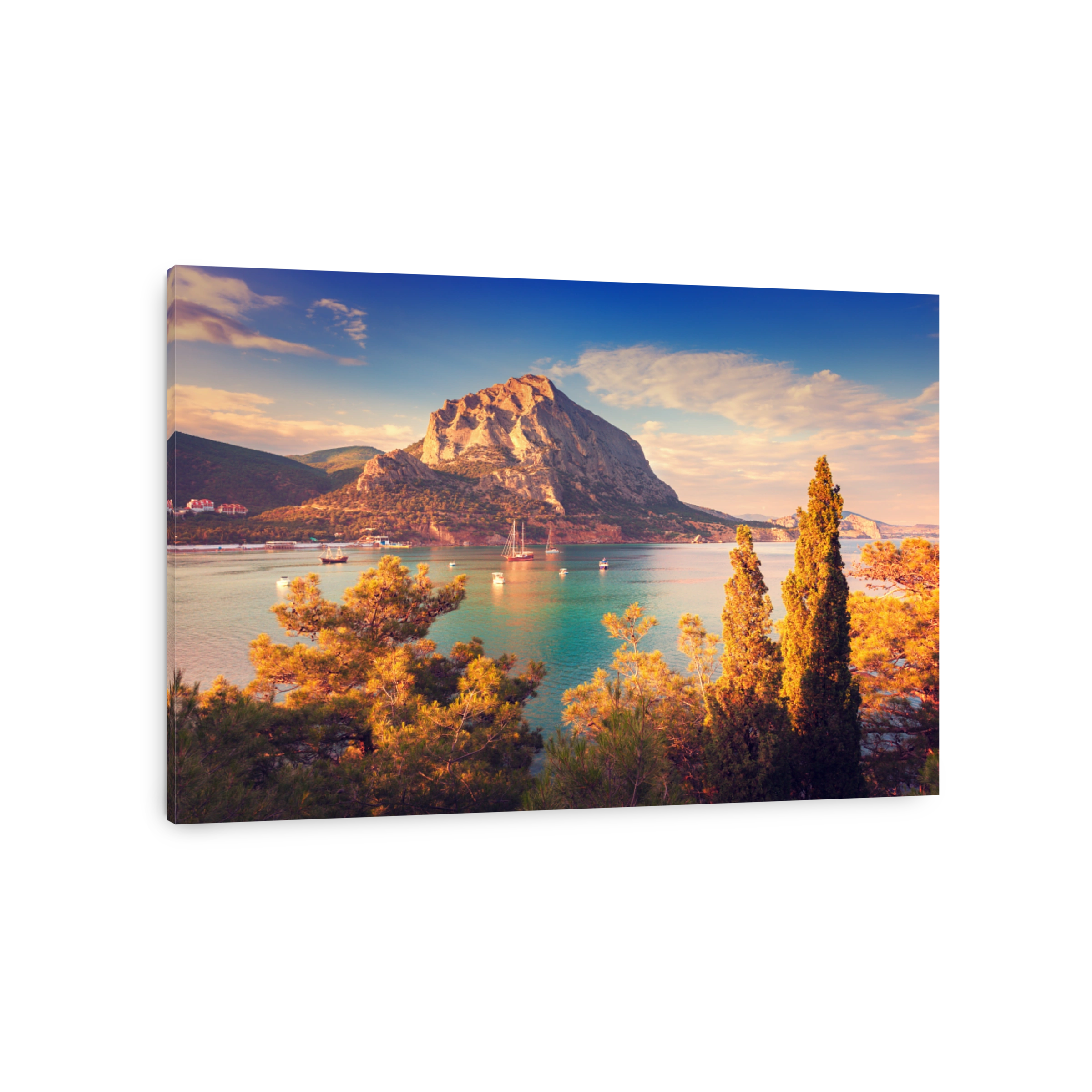 Beautiful summer sunset at the sea with mountains and trees