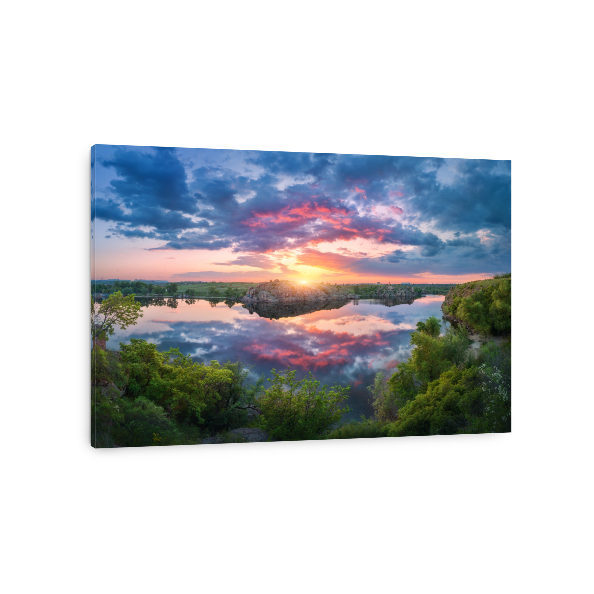 Gorgeous scene with river, green trees, rocks and amazing blue sky with colorful clouds reflected in water at sunset. Fantastic summer landscape with lake, overcast sky and yellow sun in the evening