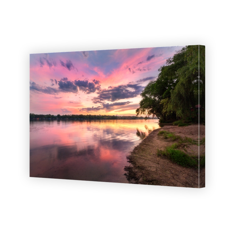 Tranquil scene with river and colorful sky with clouds at sunset. Amazing landscape with lake, beach, red sky with multicolored clouds reflected in water at dusk. Nature background.Reflection in water