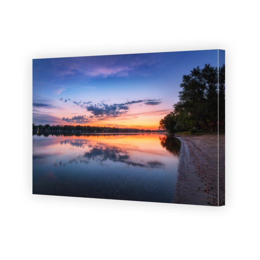 Tranquil scene with river and colorful sky with clouds at sunset. Amazing landscape with lake, blue sky with orange and red clouds reflected in water at twilight. Nature background.Reflection in water