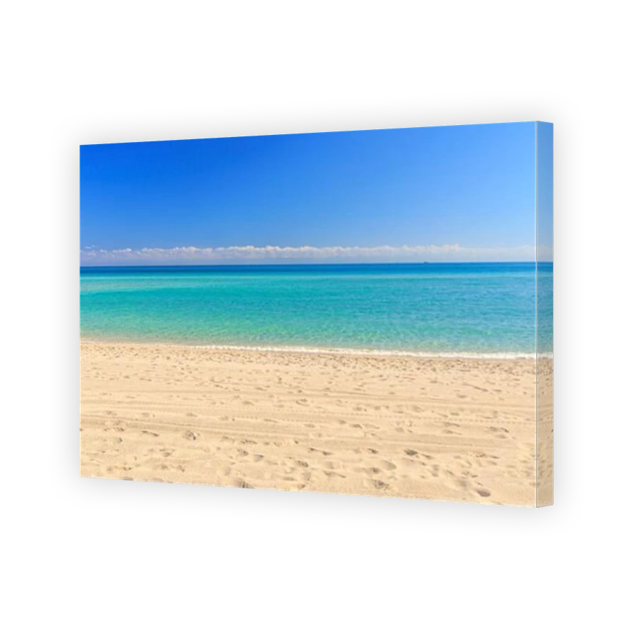 View from the Miami Beach beachfront to the turquoise ocean with blue sky without people
