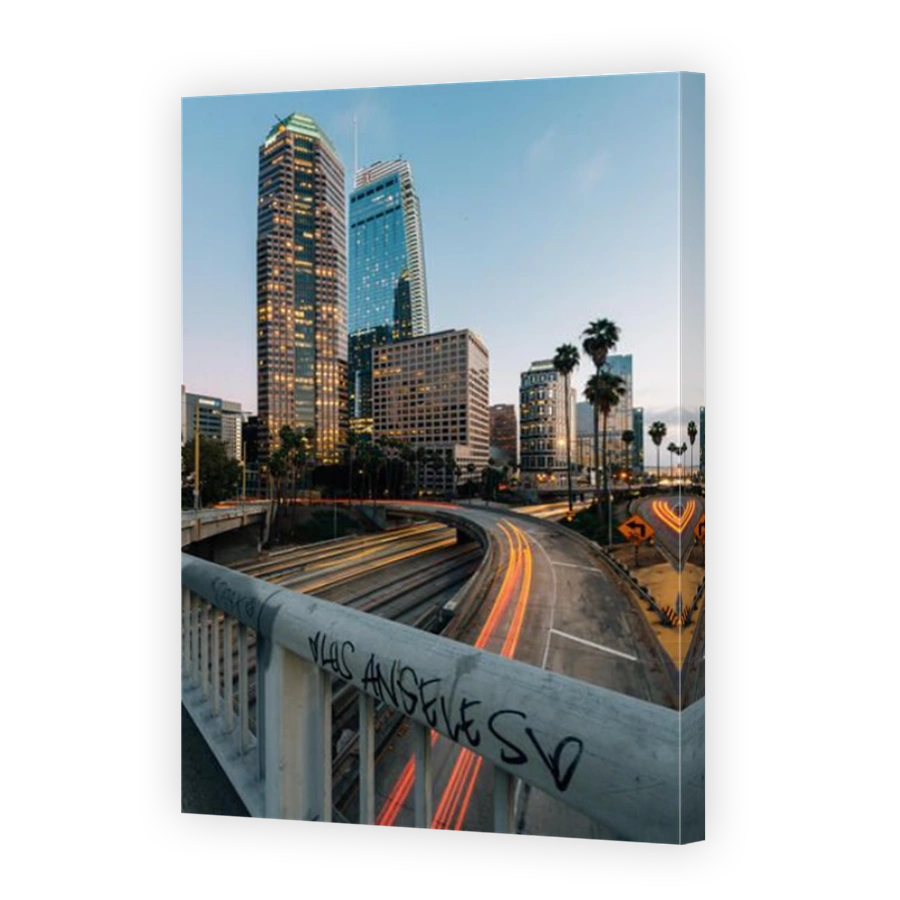 Cityscape skyline view of the 110 Freeway at night in downtown Los Angeles, California