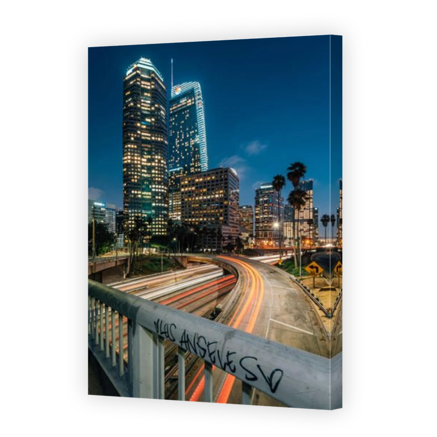 Cityscape skyline view of the 110 Freeway at night in downtown Los Angeles, California