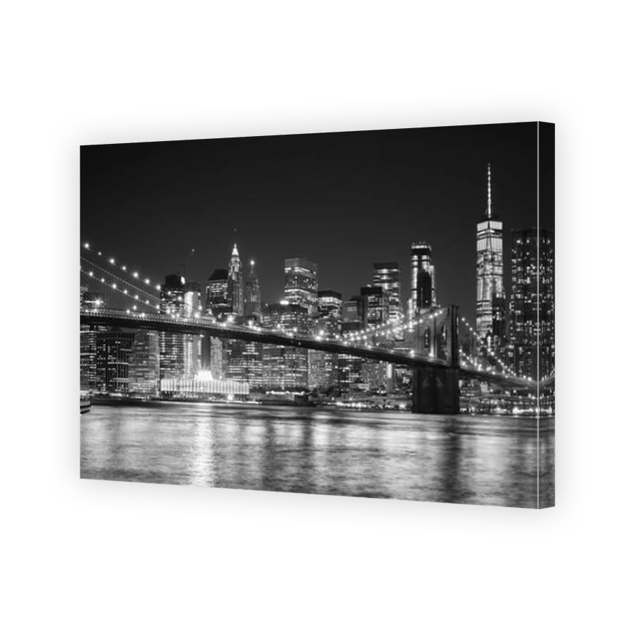Black and white night view of Manhattan waterfront, New York City, USA.